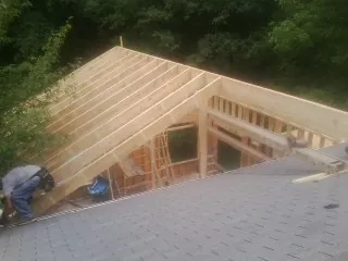 Framing a new roof addition that ties into an existing shingle roof in Gallatin Gateway